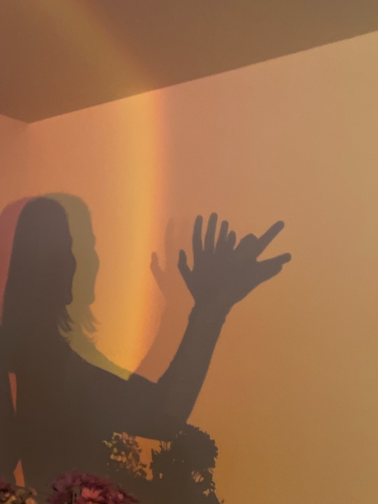Colored light and shadow on a wall